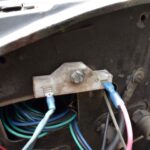 Ballast resistor in car engine bay, a component to check during car ignition problem diagnosis.