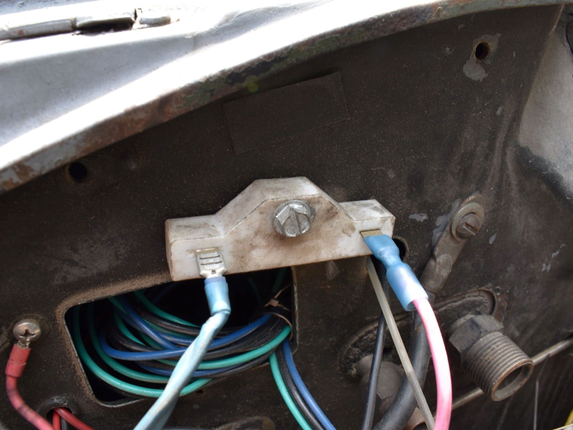 Ballast resistor in car engine bay, a component to check during car ignition problem diagnosis.