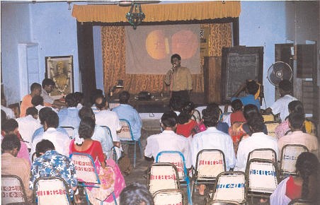 Discussion on the common eye diseases for community volunteers: mostly teachers, traditional healers and senior students. An ICEH slide set is being used. Vivekananda Mission Asram, West Bengal, India